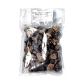 Beutel mit gefrorenen schwarzen Trüffelstücken von Tuber Melanosporum für die Gourmetküche