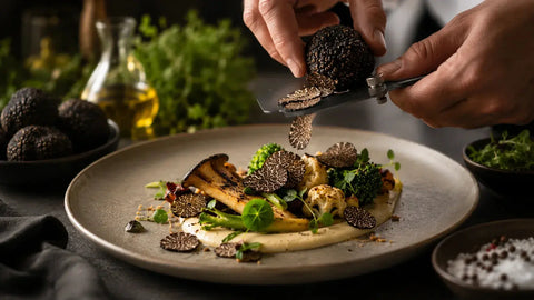 Fresh black truffles with plant-based gourmet ingredients in a fine dining restaurant kitchen