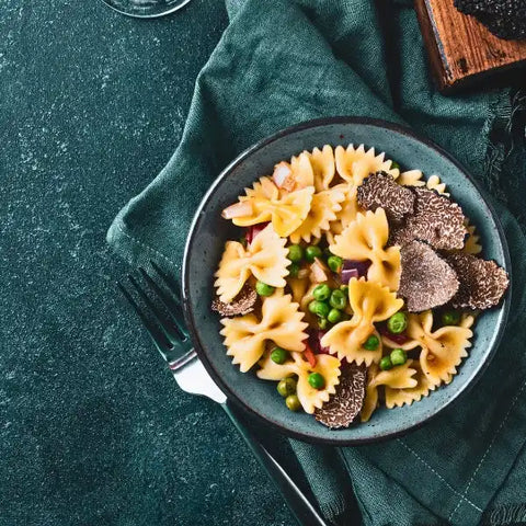 Farfalle pasta with peas and truffles.