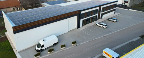 Modern commercial building with solar panels.