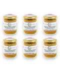 Porcini mushroom and white truffle cream jars with gold lids and labels on white background