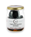 Glass jar of black truffles in brine with a gold lid for Tuber Aestivum product